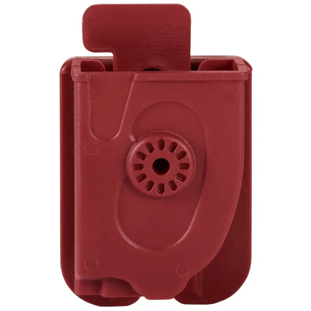 Red plastic holster or clip with a circular opening and a protruding tab.