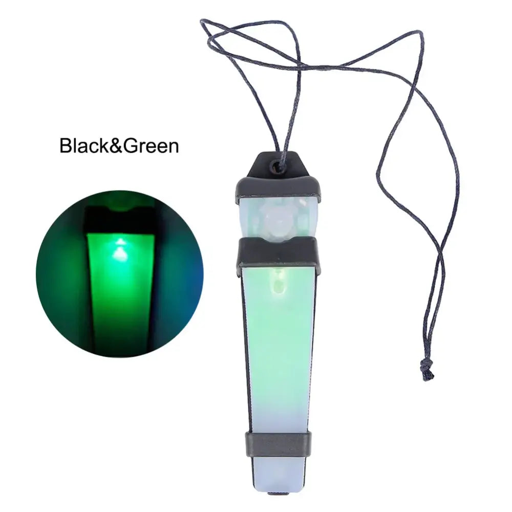 Portable LED lantern with a green light and hanging strap.