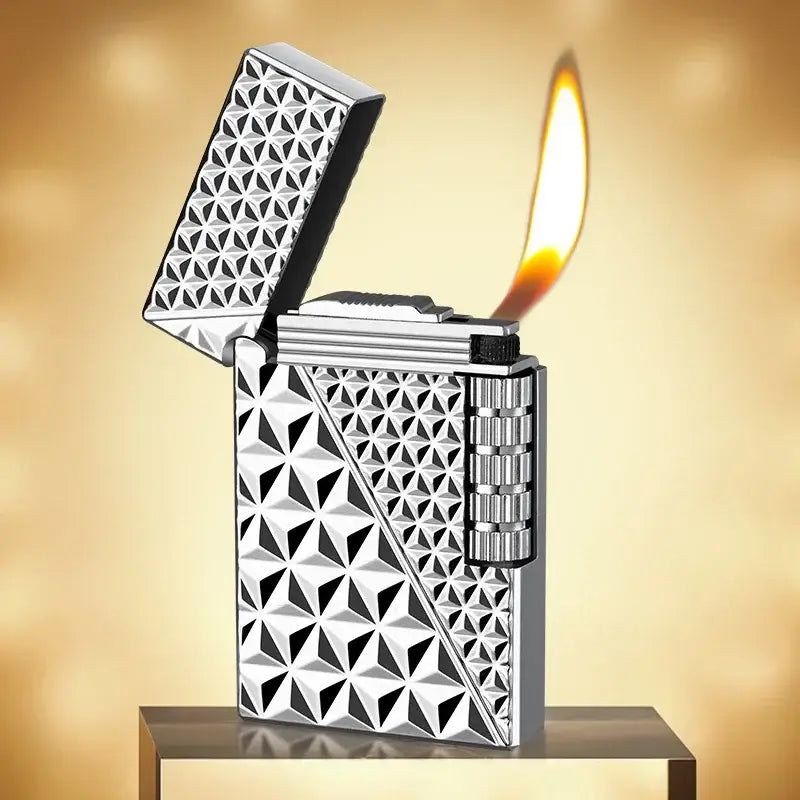 Ornate silver lighter with a geometric pattern and lit flame.