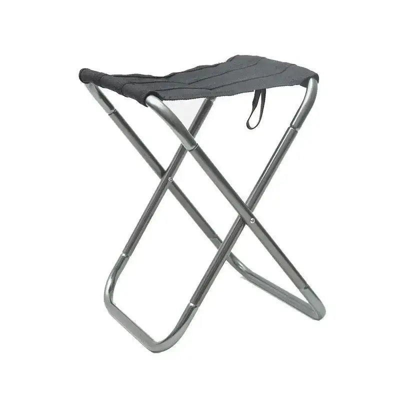 Folding camping stool with a gray fabric seat and metal frame.