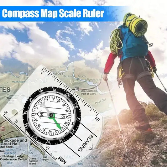 Compass with integrated map scale ruler.