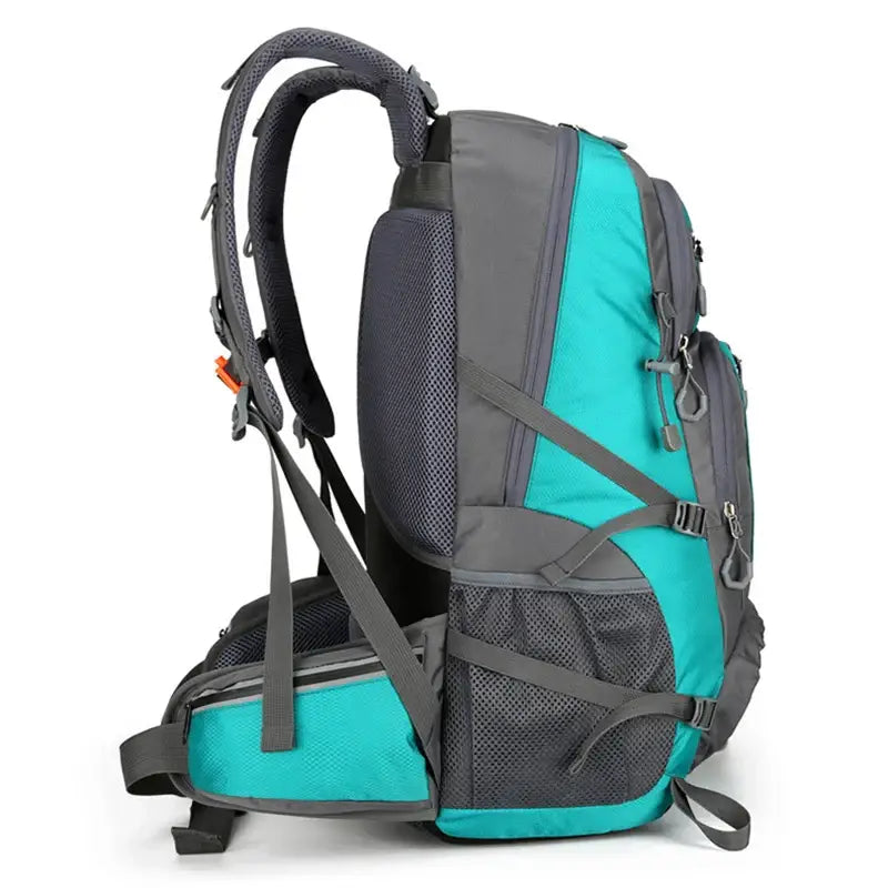 Teal and gray hiking backpack with multiple compartments and padded straps.