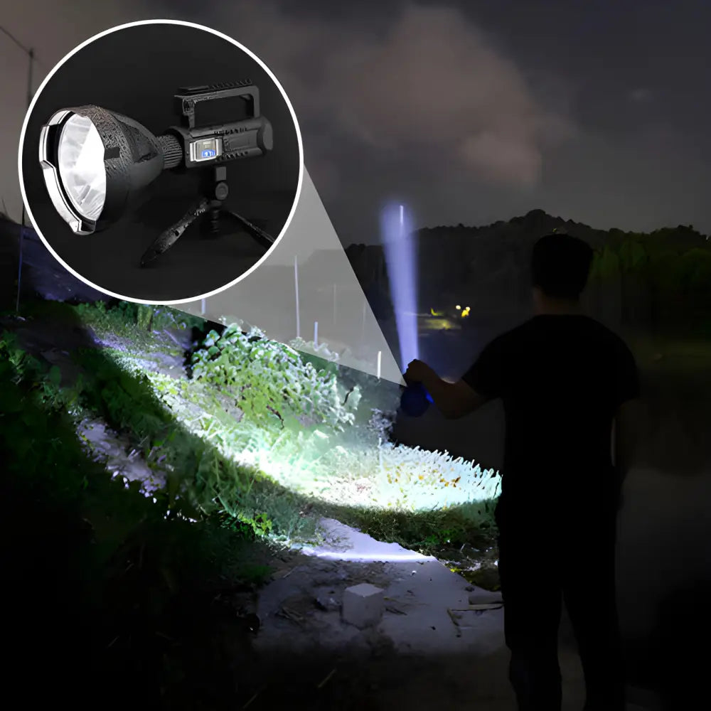 High-powered flashlight or spotlight illuminating a path in darkness.