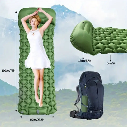 Inflatable camping sleeping pad with a person lying on it to demonstrate its size and comfort.