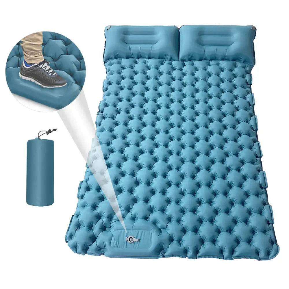 Inflatable blue camping sleeping pad with attached pillows and a textured surface.