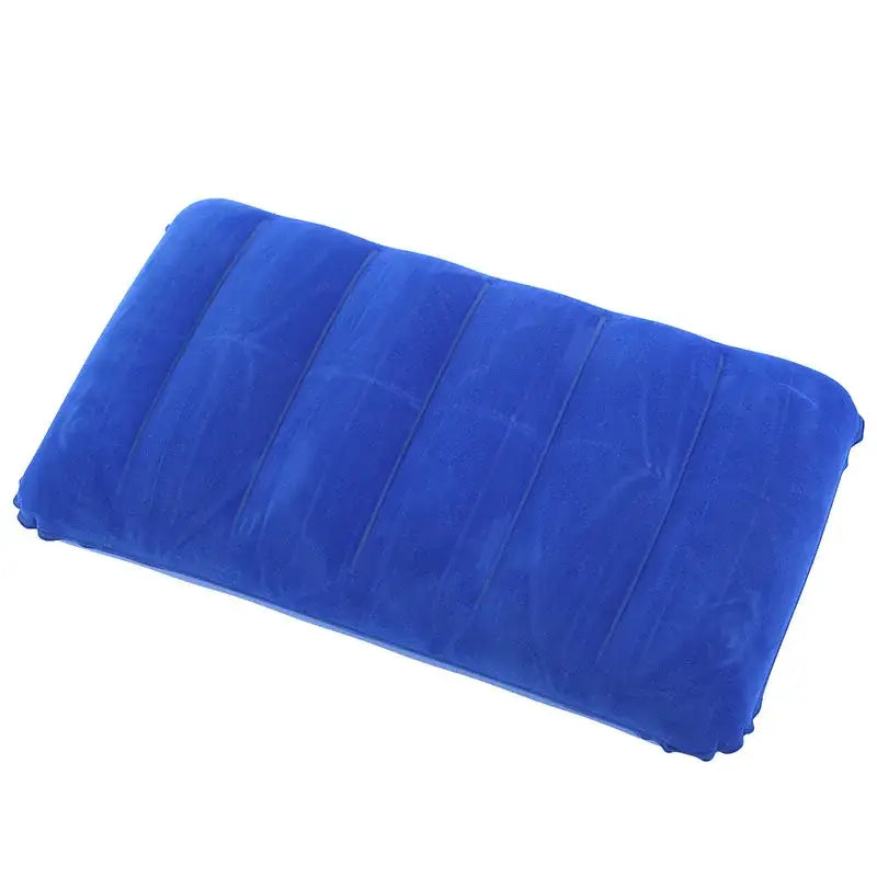 Blue inflatable travel pillow or cushion with ribbed sections.