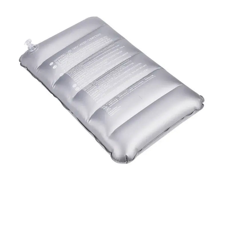 Inflatable gray pillow or cushion with horizontal ribbed sections.