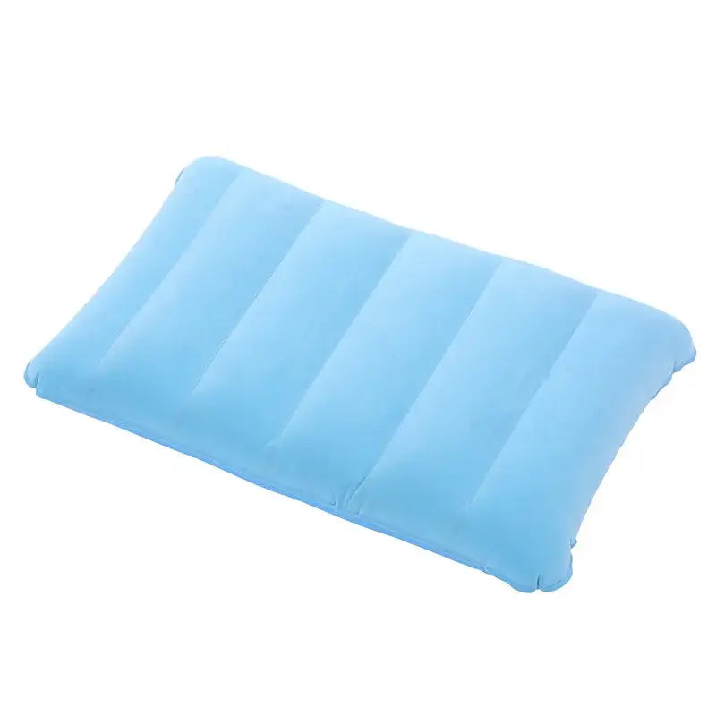 Light blue inflatable pillow with ribbed sections.