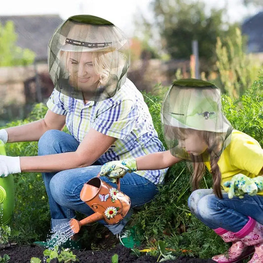 Two people wearing protective face shields while gardening together outdoors.