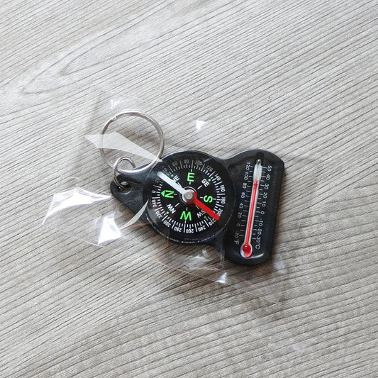 Keychain with a compass and thermometer attached.