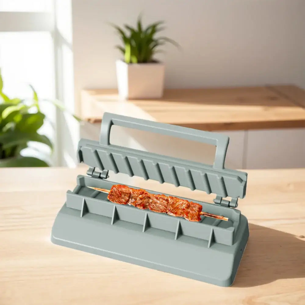 Food sealer or vacuum sealer device with an orange food item visible inside.