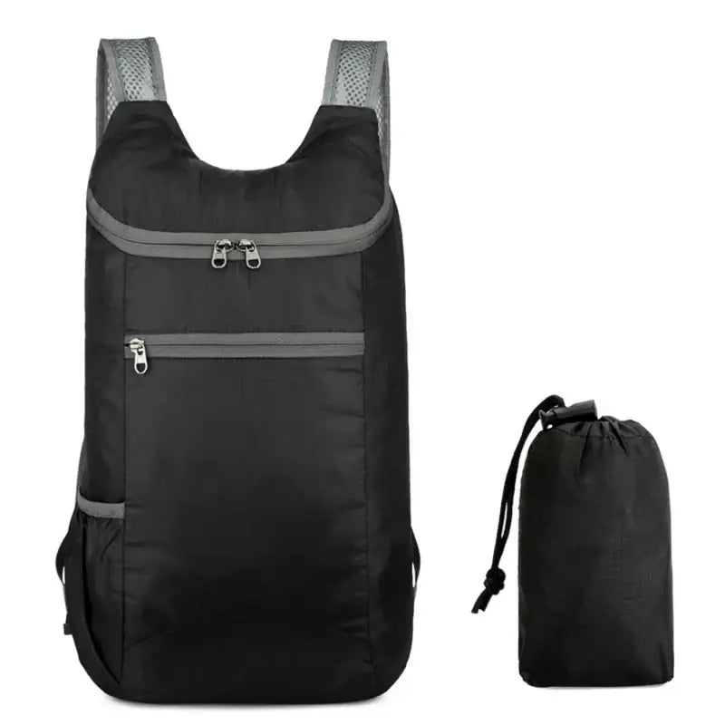 Black backpack with multiple zippered compartments and mesh shoulder straps.