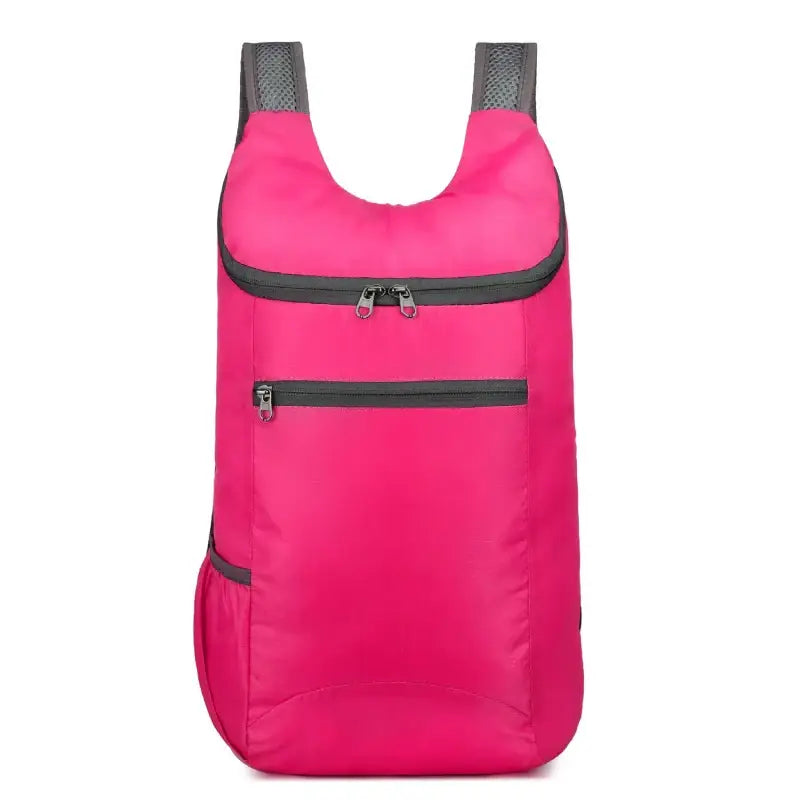 Bright pink backpack with gray straps and zipper details.