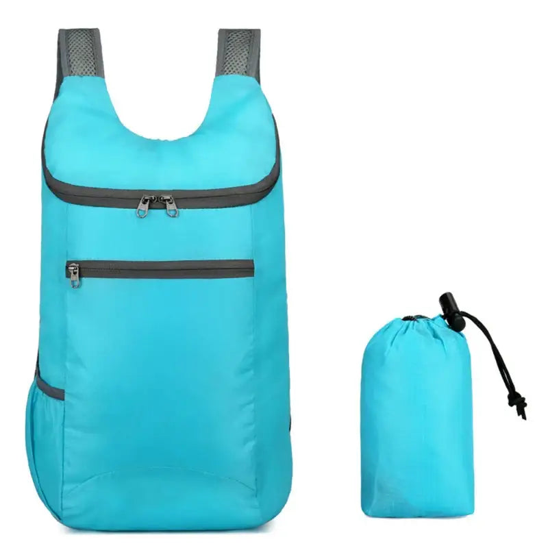 Bright turquoise backpack with gray straps and zippers, accompanied by a matching compact storage pouch.