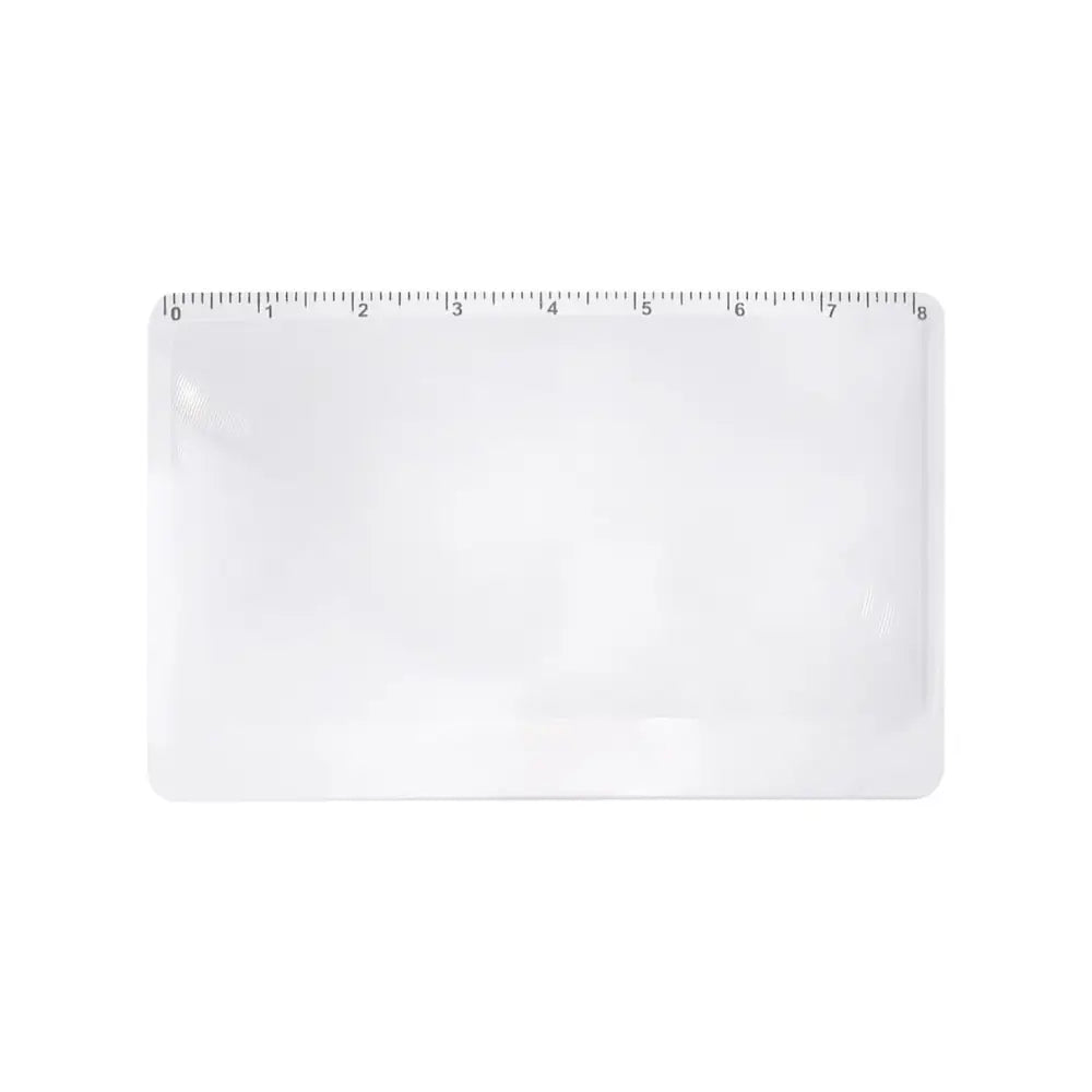 White plastic ruler or measuring scale with inch markings.