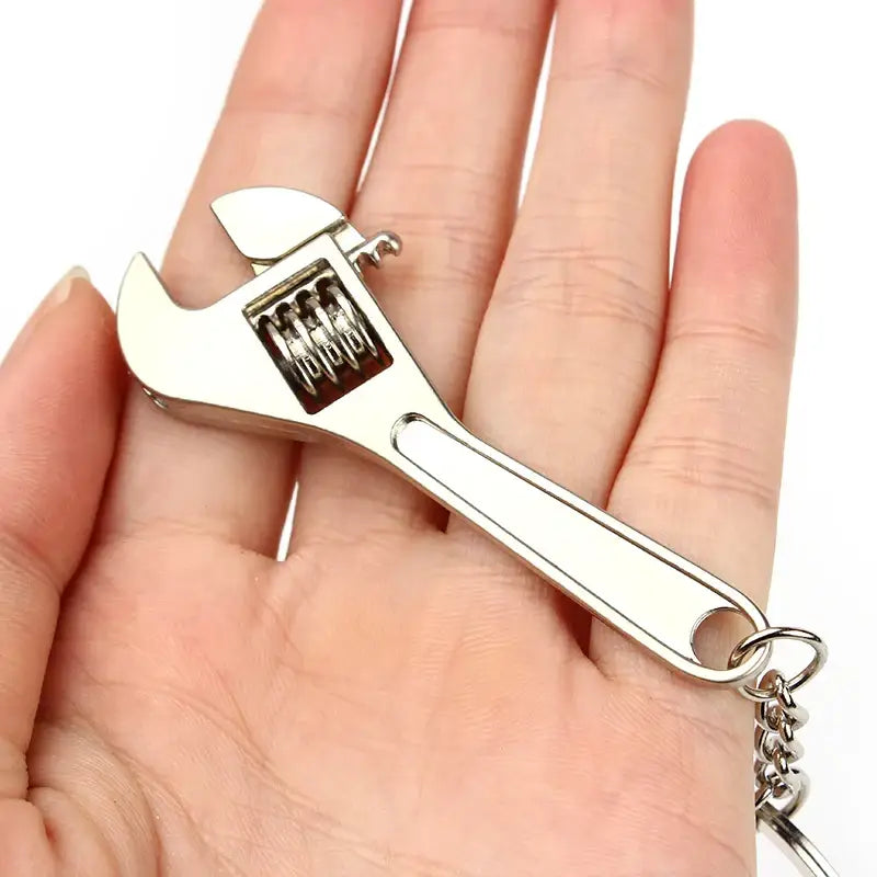 Adjustable wrench with a keychain attachment.