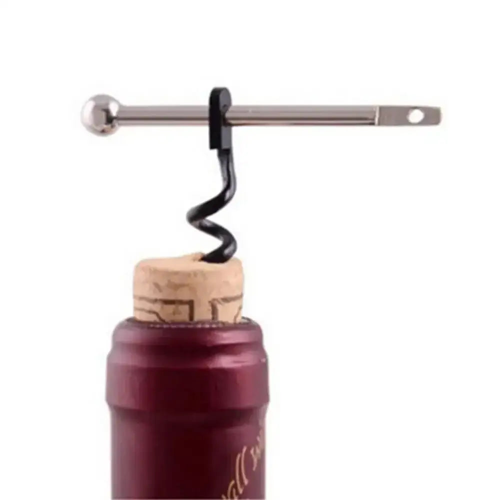 Corkscrew inserted into the cork of a wine bottle.