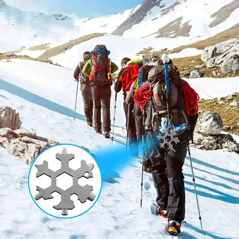 Group of hikers traversing a snowy mountain slope with ski poles and backpacks.