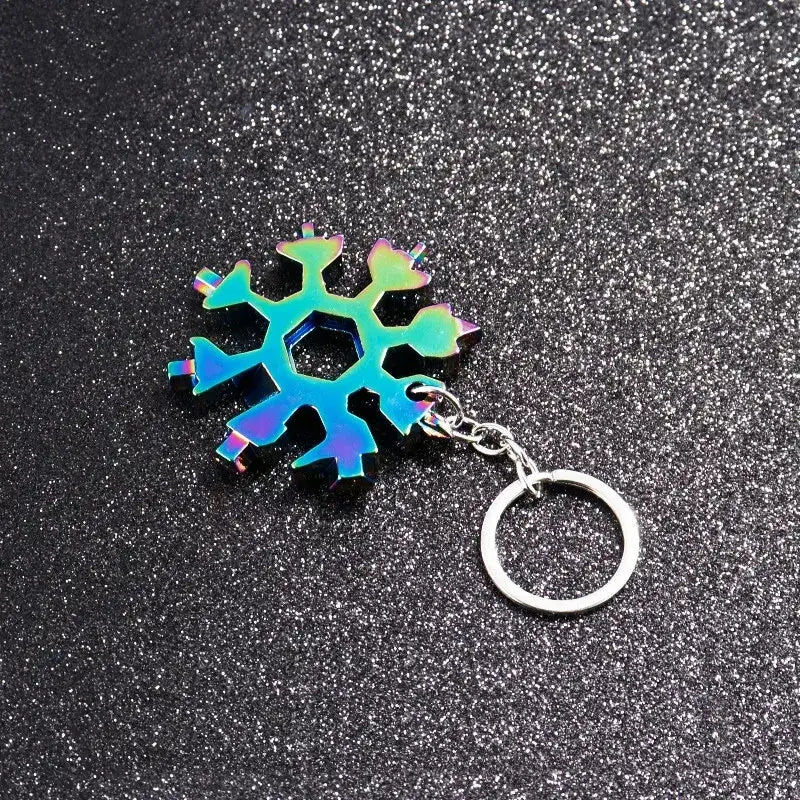 Iridescent snowflake-shaped keychain with a metallic ring attached.