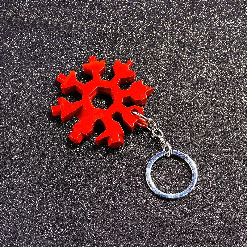 Red snowflake-shaped multitool keychain.