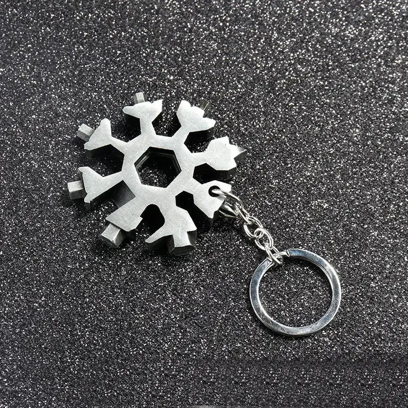 Metallic snowflake-shaped multi-tool keychain.