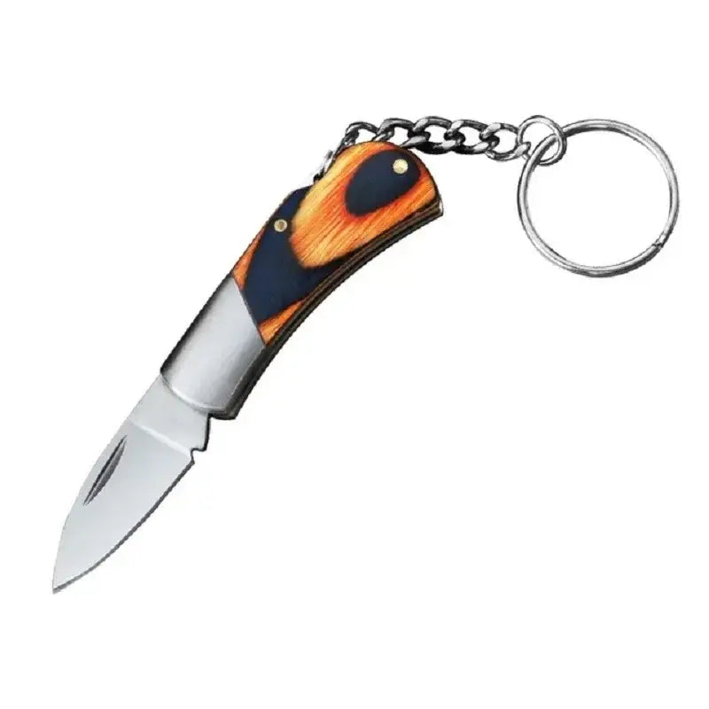 Folding pocket knife with an orange and black handle attached to a keychain.