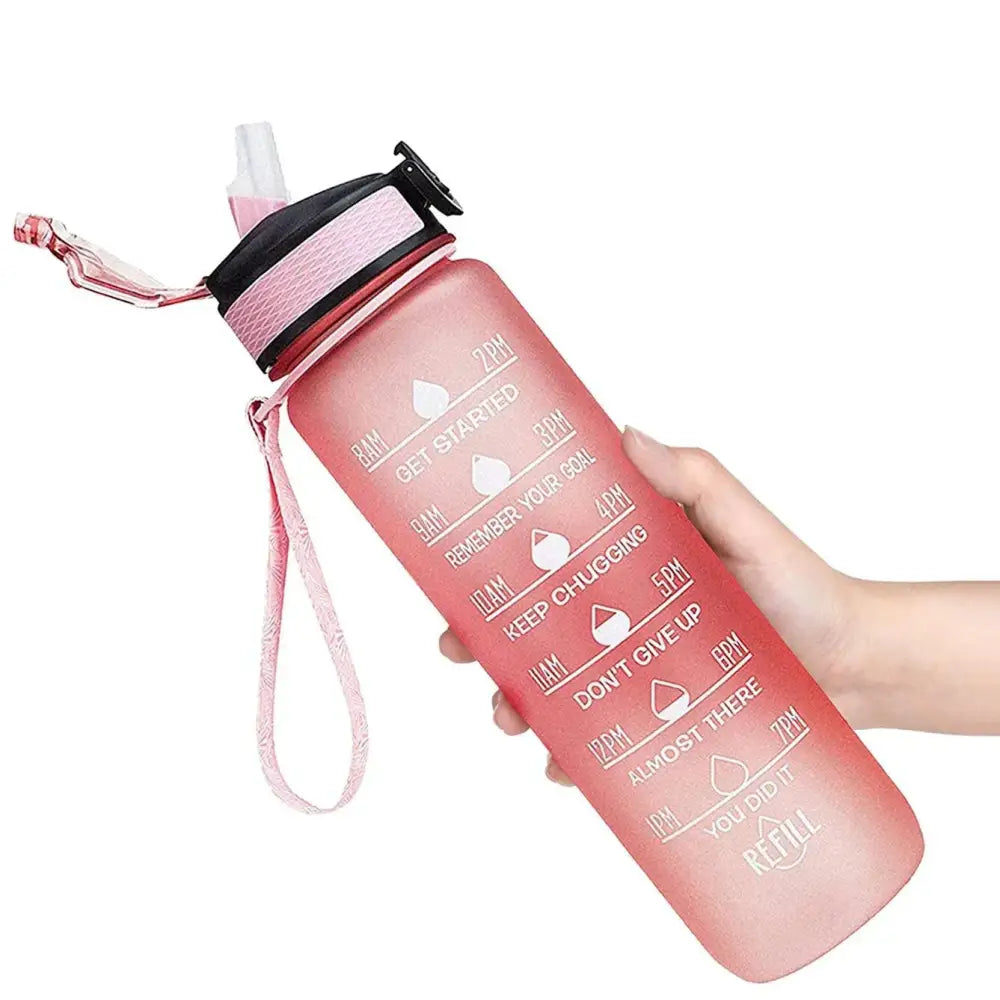 Pink water bottle with time markings and motivational text.