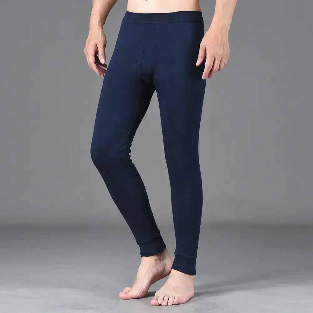 Navy blue form-fitting leggings or thermal underwear worn on a person’s legs.