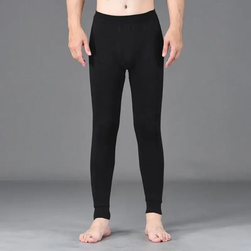 Black fitted leggings or thermal underwear worn by a person.