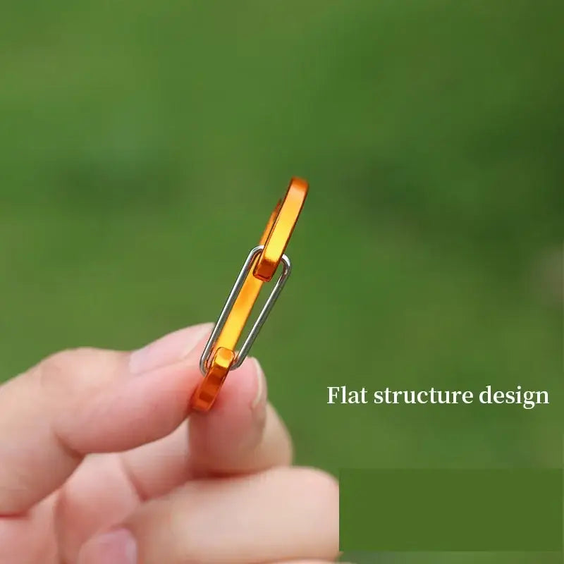 Thin, flat, golden ring with a unique rectangular profile design.