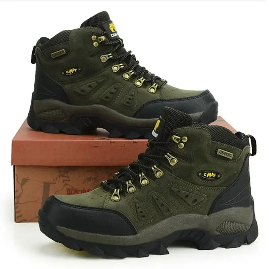 Pair of olive green and black hiking boots with yellow accents.