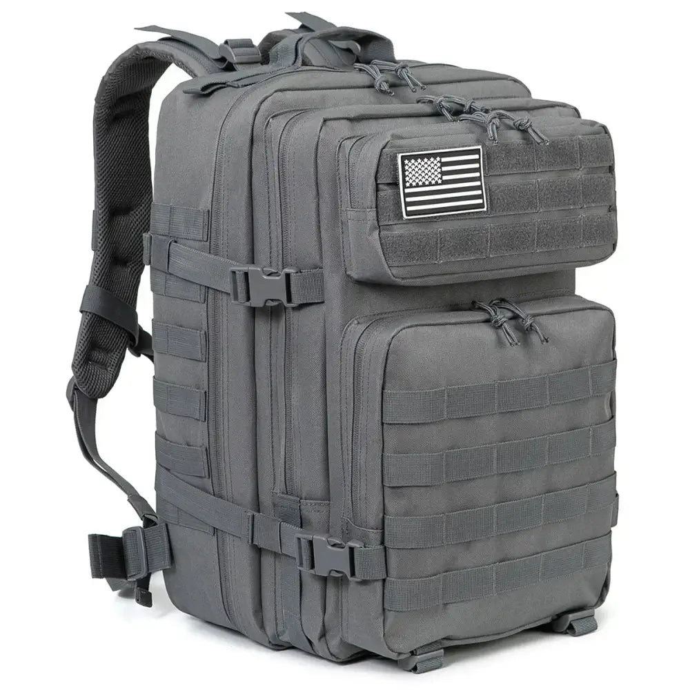 Military-style tactical backpack with MOLLE webbing and an American flag patch.