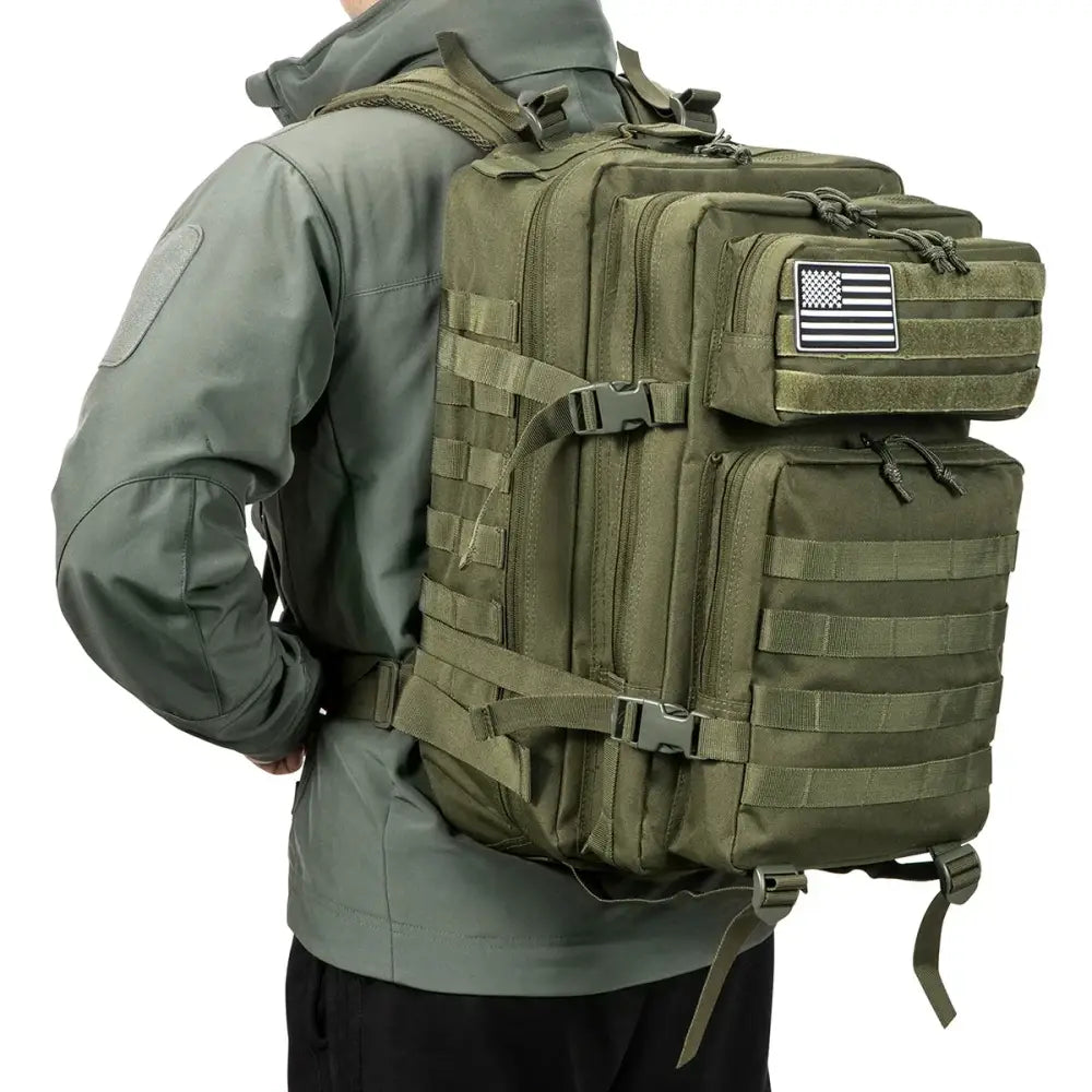 Military-style tactical backpack with multiple compartments and a flag patch.