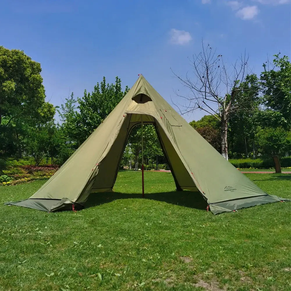 Olive green teepee-style camping tent set up on grass.