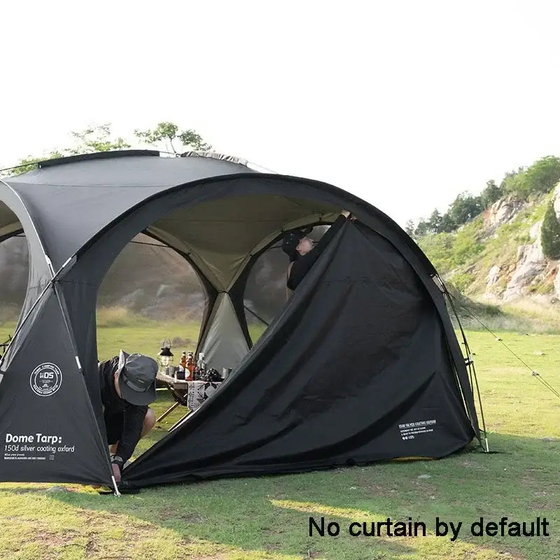 Dome-shaped camping tent with an open front panel.