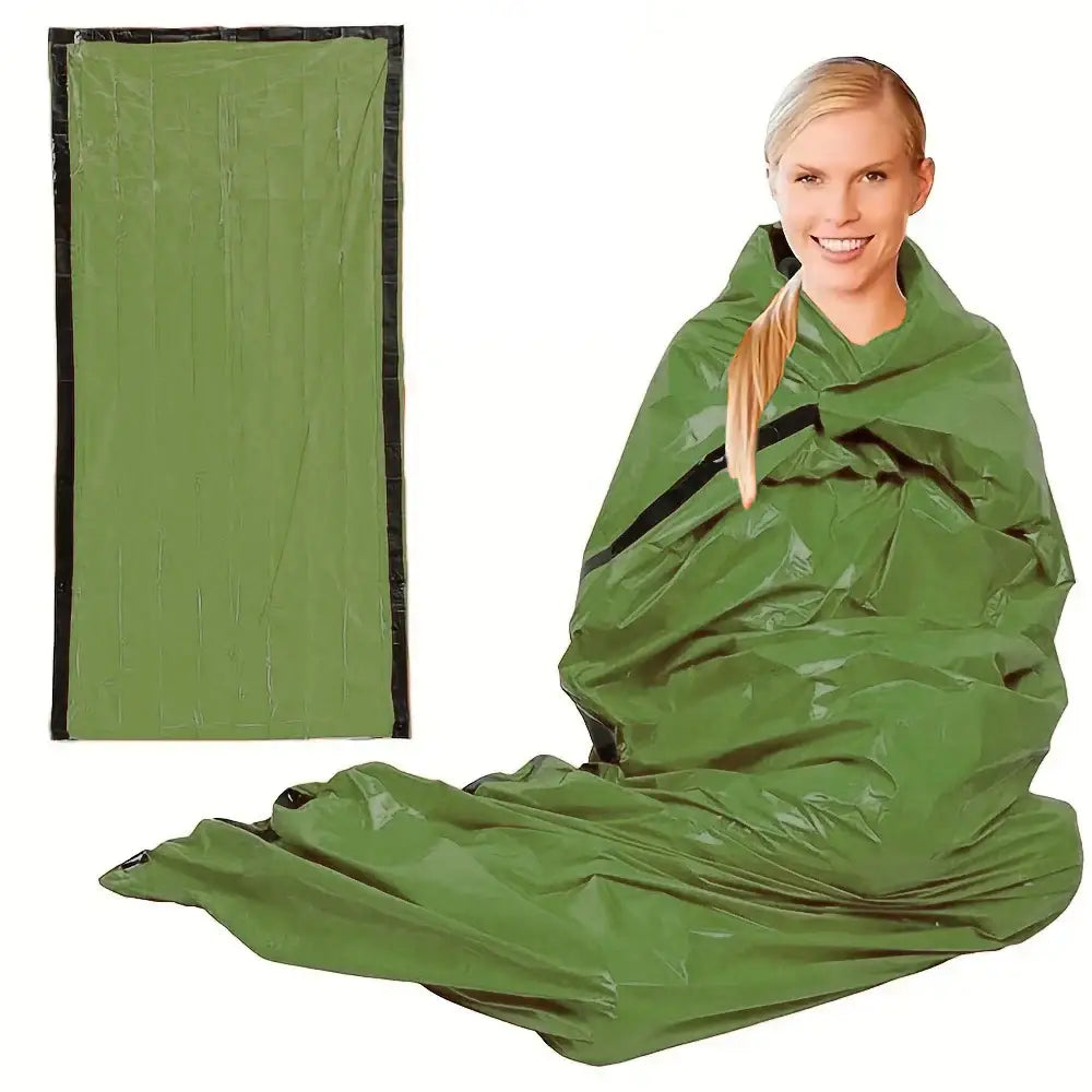 Emergency survival blanket or sleeping bag in olive green color.