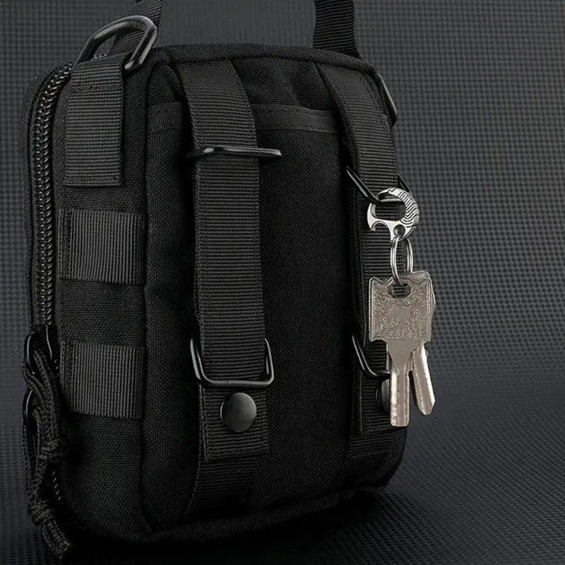 Black tactical pouch with attached keys.