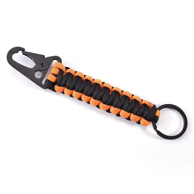 Paracord keychain with a carabiner clip in black and orange colors.