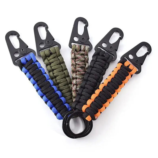 Set of paracord survival keychains in various colors with carabiner clips.