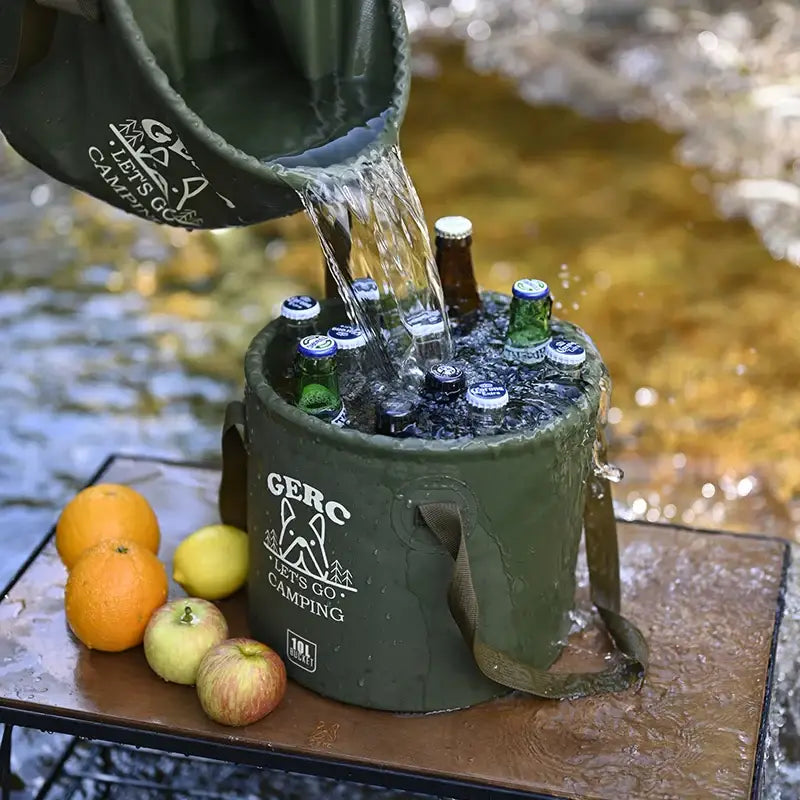 Portable cooler filled with beer bottles being filled with water from a jug.