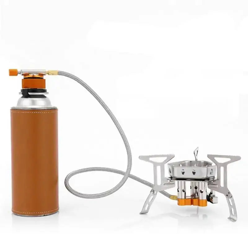 Portable camping stove with attached fuel canister.