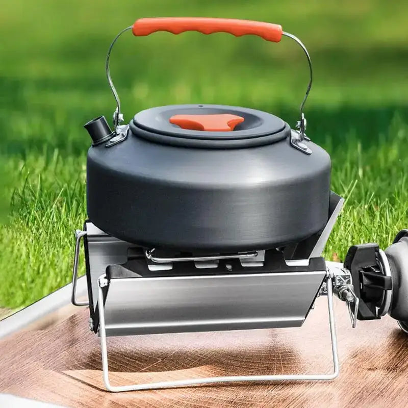 Camping kettle on a portable stove.