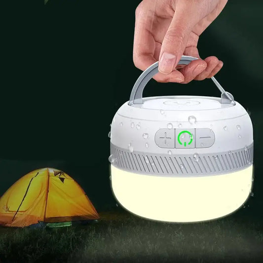 Portable LED camping lantern with a handle and control buttons.