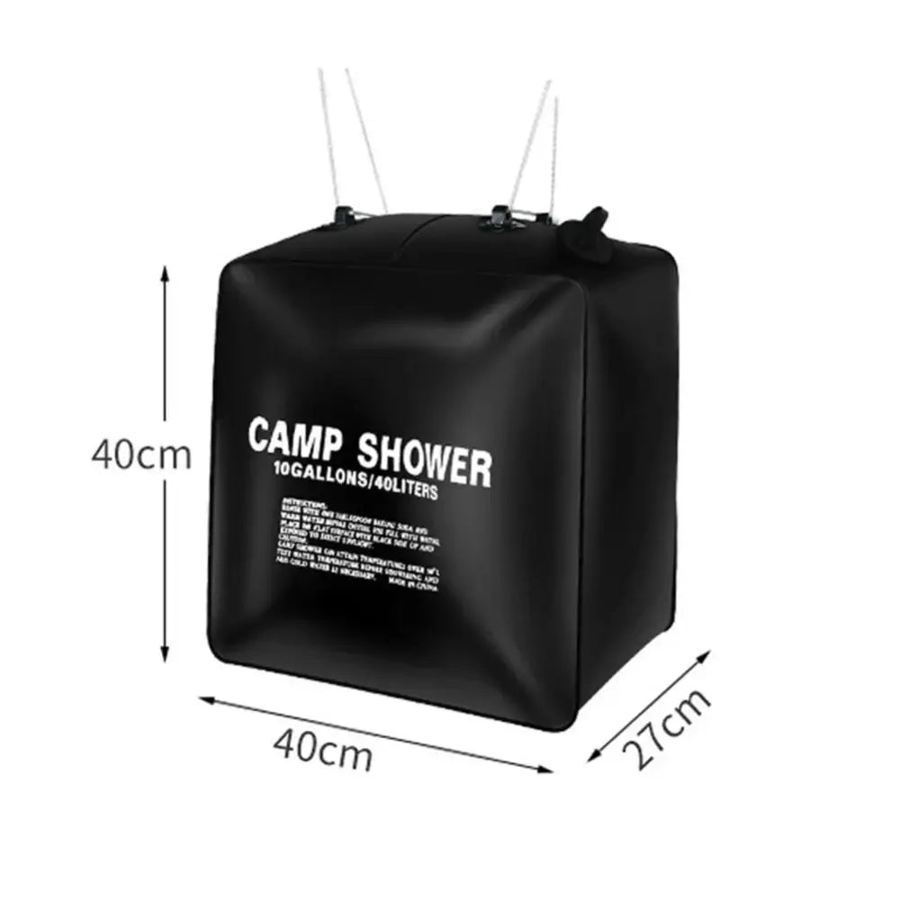 Black cube-shaped portable camp shower bag with dimensions labeled.