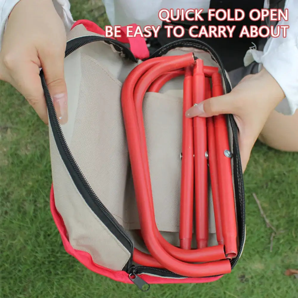 Foldable camping chair or stool with red frame being unfolded from a carrying case.