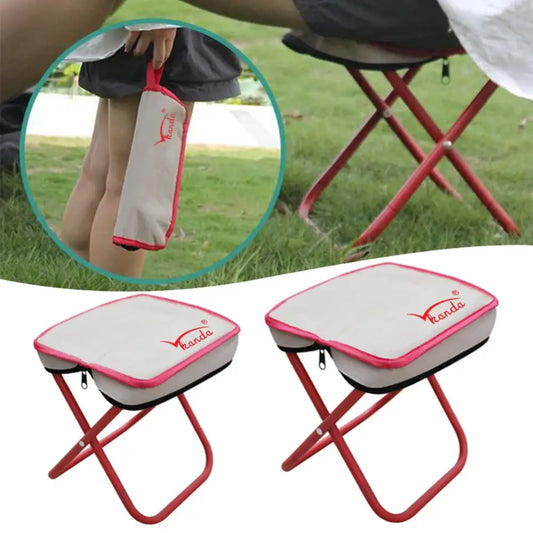 Portable folding stool with a canvas seat and red metal frame.