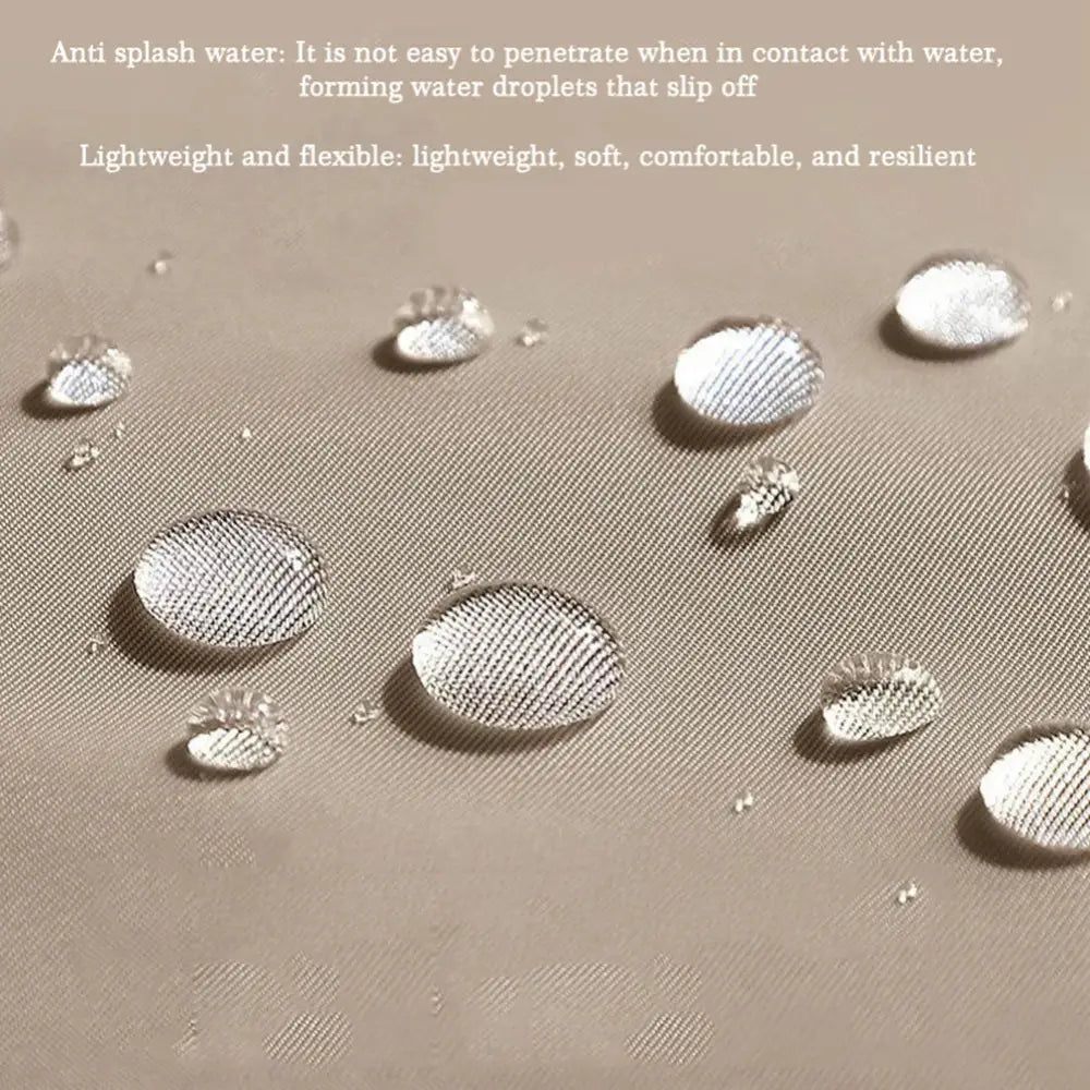 Water droplets beading on a water-resistant fabric surface.