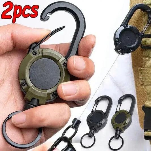 Retractable key chain carabiner with a circular body and hook attachment.