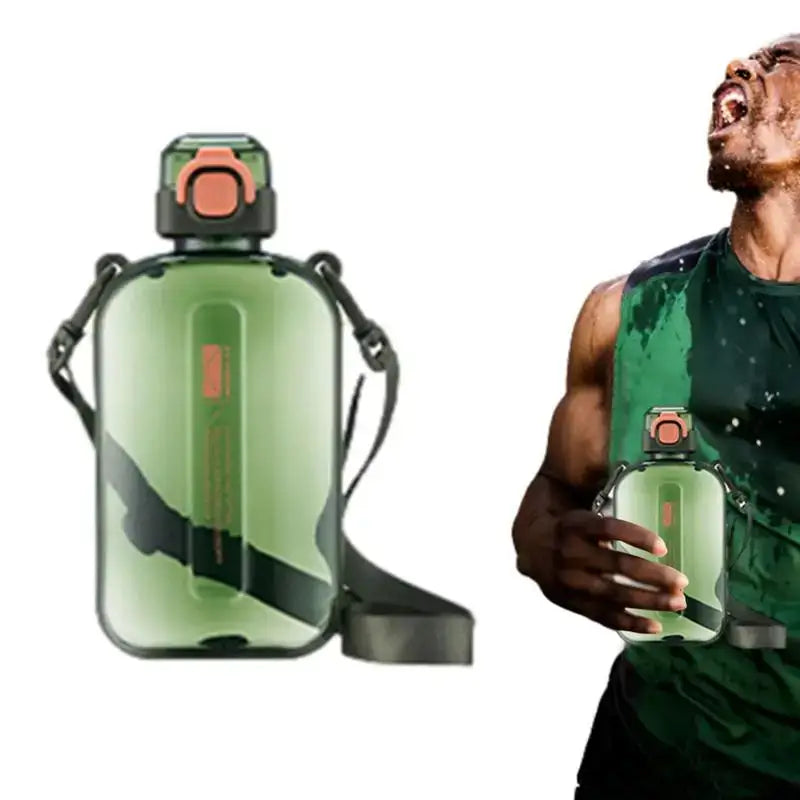 Green reusable water bottle with a built-in handle and strap.