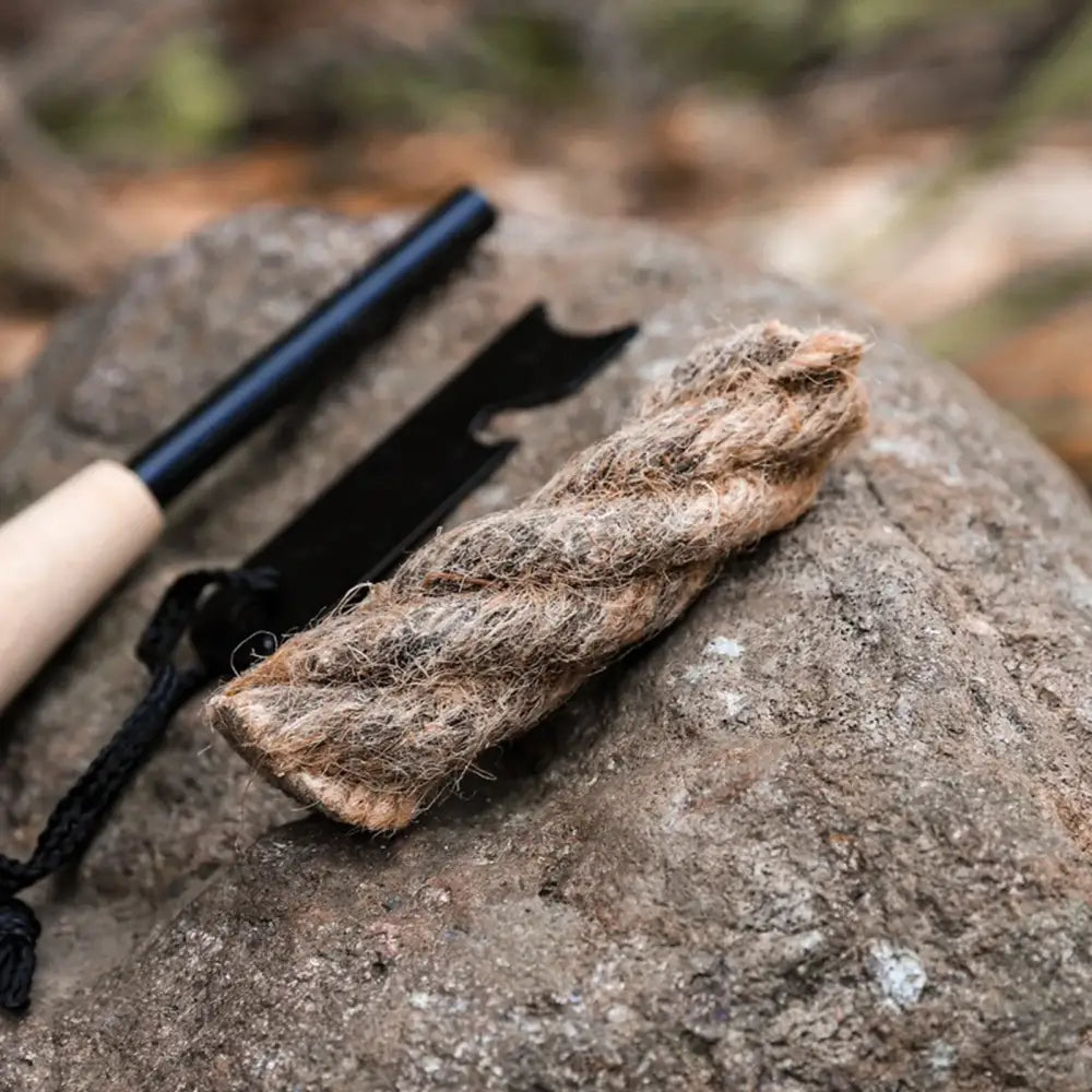 Twisted piece of rope or cordage lying on a rock.